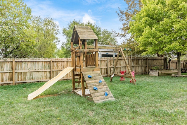 view of playground featuring a lawn