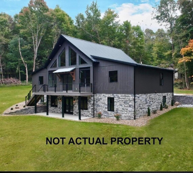 back of property featuring a lawn, a patio area, and a deck