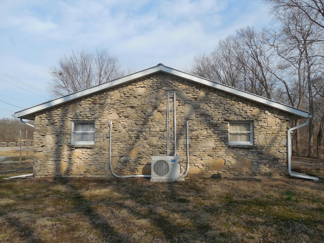 view of side of property featuring ac unit