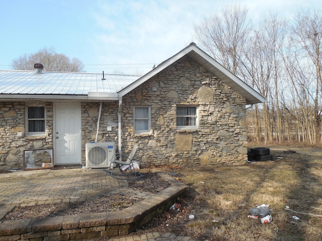 exterior space featuring ac unit and a patio area