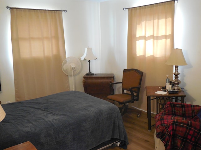 bedroom with hardwood / wood-style floors