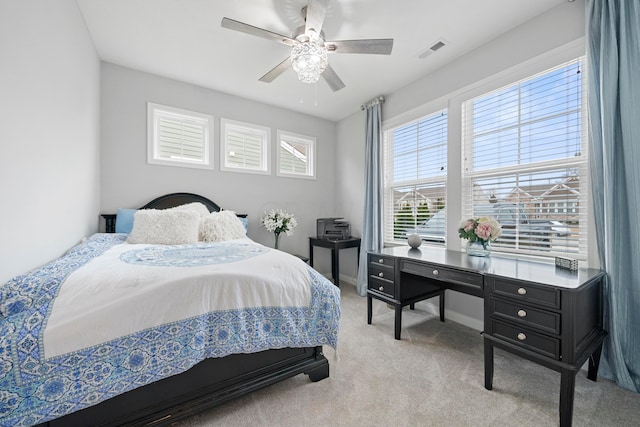 bedroom featuring ceiling fan and light carpet