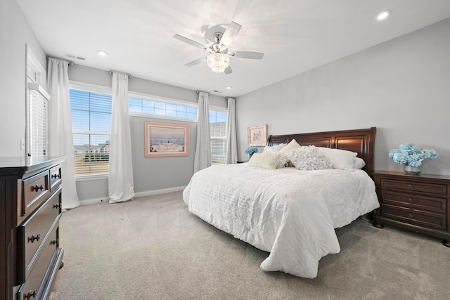 carpeted bedroom with ceiling fan