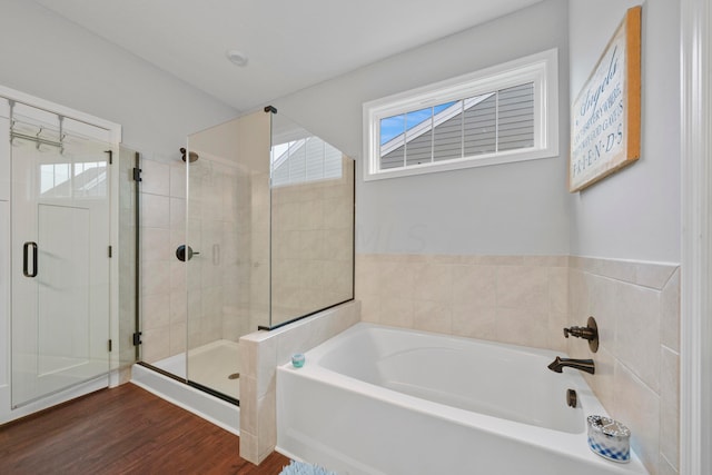 bathroom with hardwood / wood-style floors and plus walk in shower