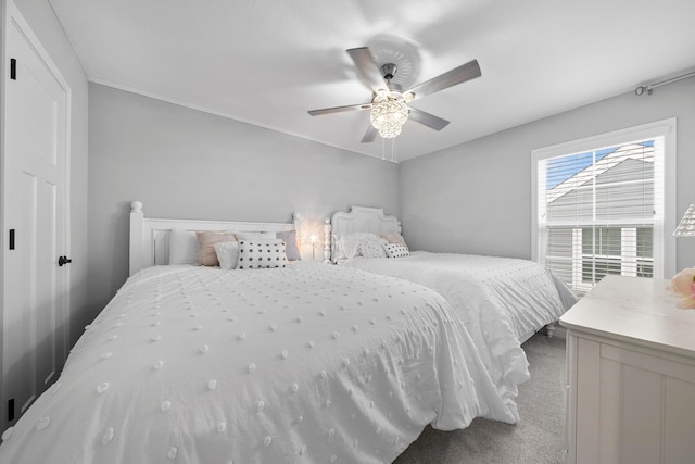 carpeted bedroom featuring ceiling fan