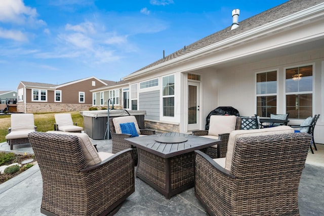 view of patio / terrace featuring a hot tub