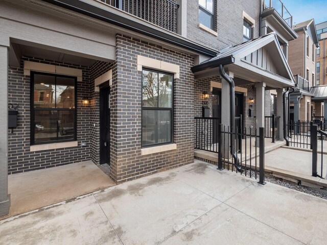 entrance to property with a patio area