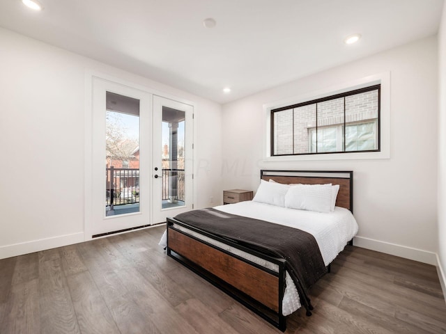 bedroom featuring access to outside and dark wood-type flooring