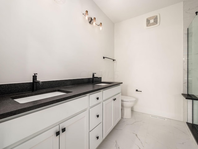 bathroom with vanity, toilet, and walk in shower