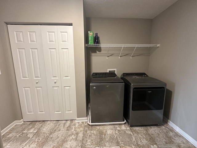 laundry room featuring washer and clothes dryer