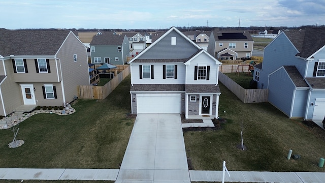 view of front of home featuring a garage and a front yard