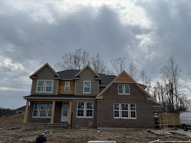 view of front of property featuring brick siding