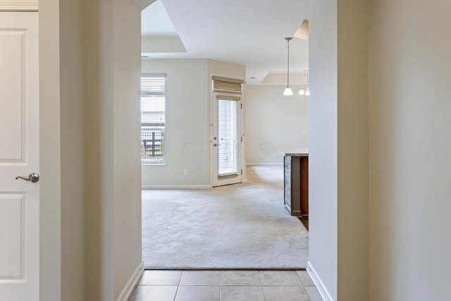 hallway featuring light carpet