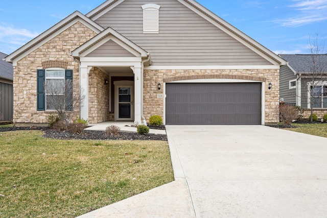 view of front of property featuring a garage and a front yard