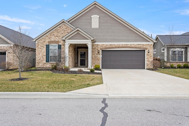 view of front of home with a front yard and a garage