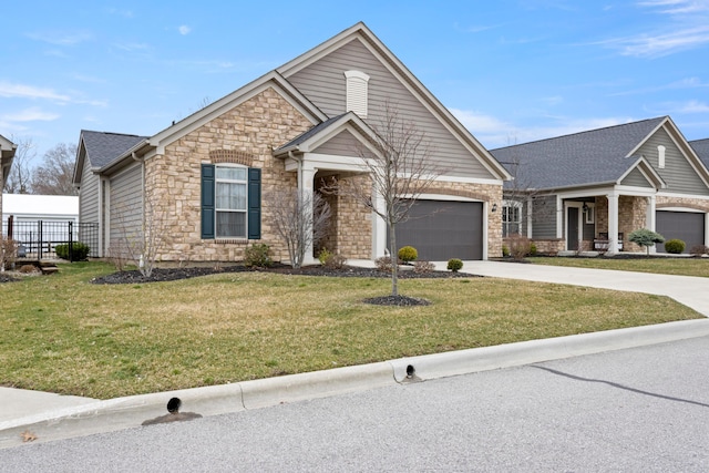 view of front of property with a garage and a front yard