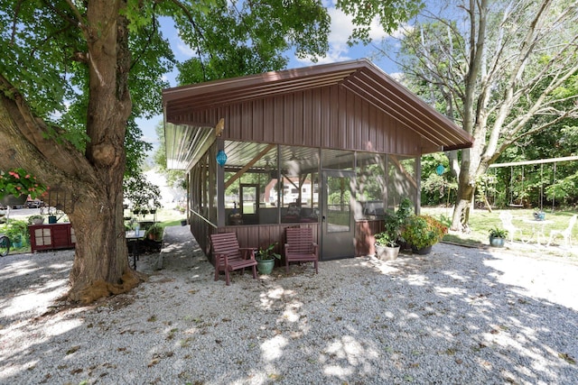 view of patio with a sunroom