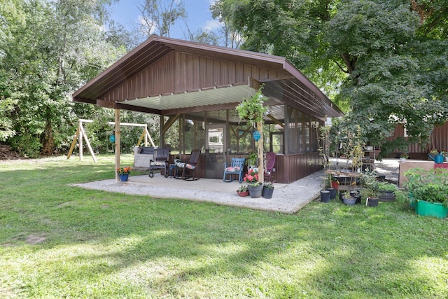 view of yard with a patio area and a playground