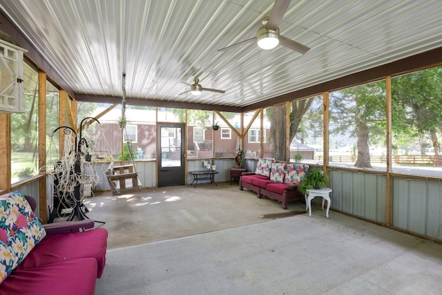 sunroom / solarium featuring ceiling fan