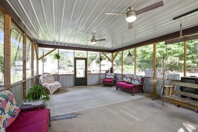 sunroom / solarium featuring ceiling fan