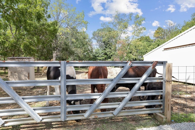 view of gate featuring an outbuilding