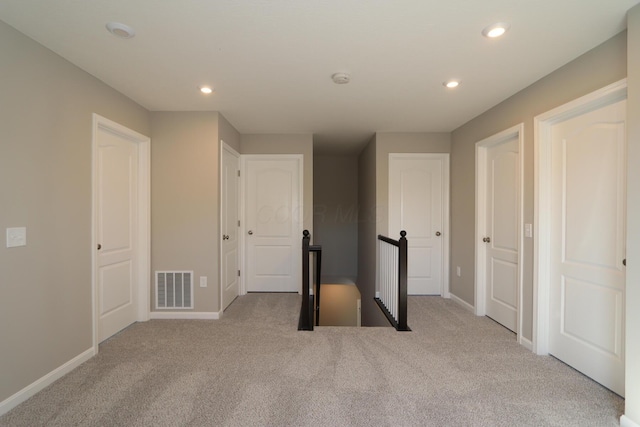 workout room with light colored carpet