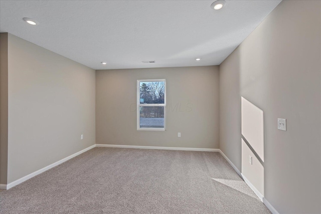 empty room featuring light carpet