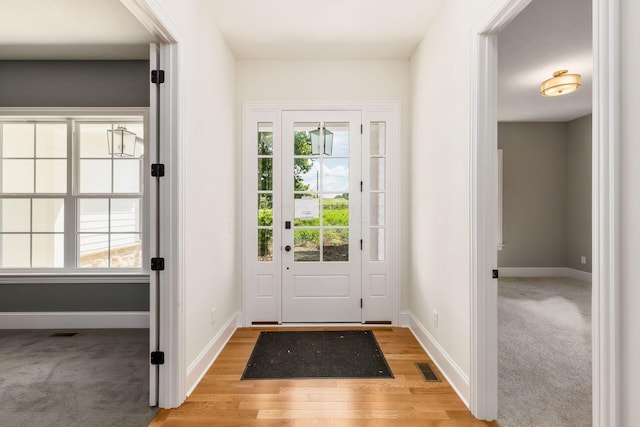 entryway with light hardwood / wood-style flooring