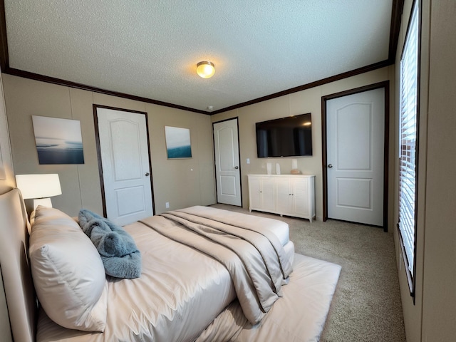 carpeted bedroom featuring crown molding and a textured ceiling