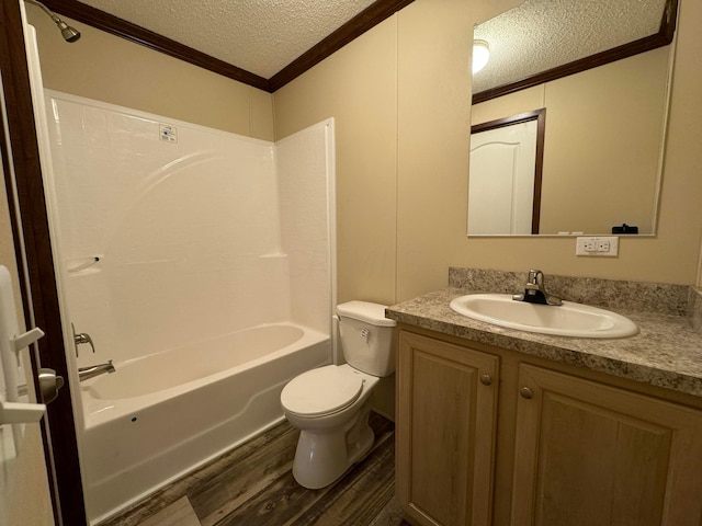 full bathroom with  shower combination, a textured ceiling, crown molding, hardwood / wood-style flooring, and toilet