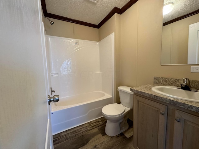 full bathroom featuring a textured ceiling, toilet, hardwood / wood-style flooring, shower / bathtub combination, and ornamental molding