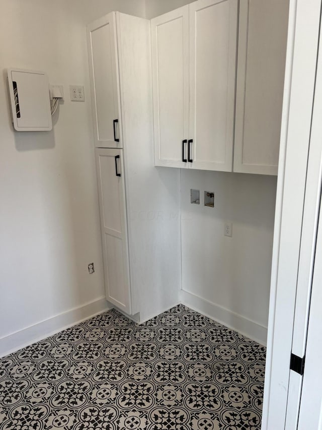 washroom with cabinets and hookup for a washing machine