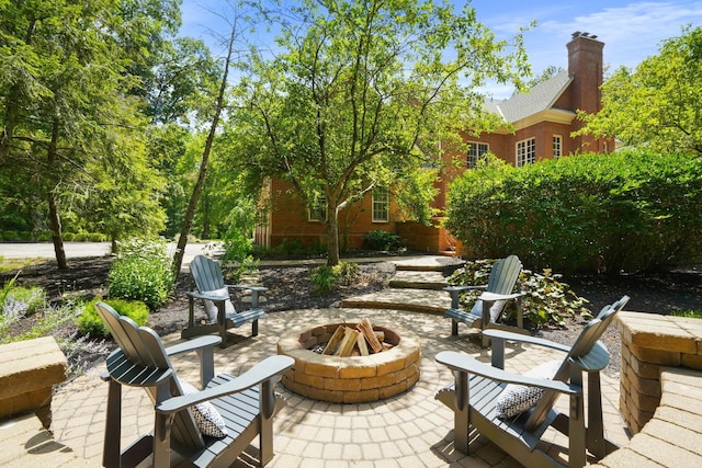 view of patio with an outdoor fire pit