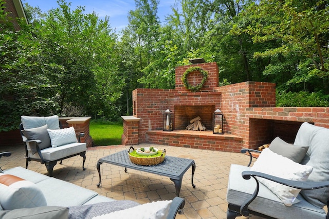 view of patio / terrace with an outdoor living space with a fireplace