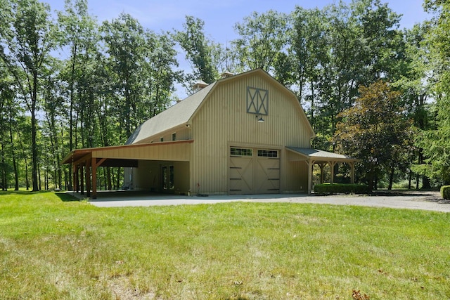 view of property exterior with a carport, a garage, and a yard