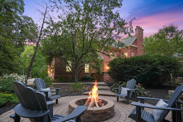 patio terrace at dusk with a fire pit