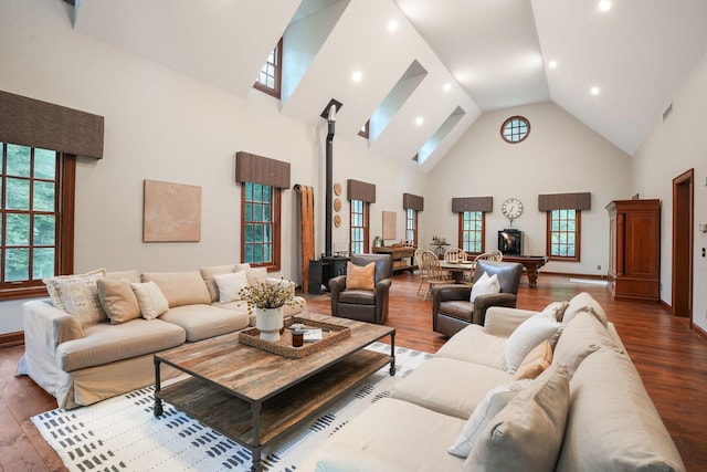 living room featuring dark hardwood / wood-style flooring and high vaulted ceiling