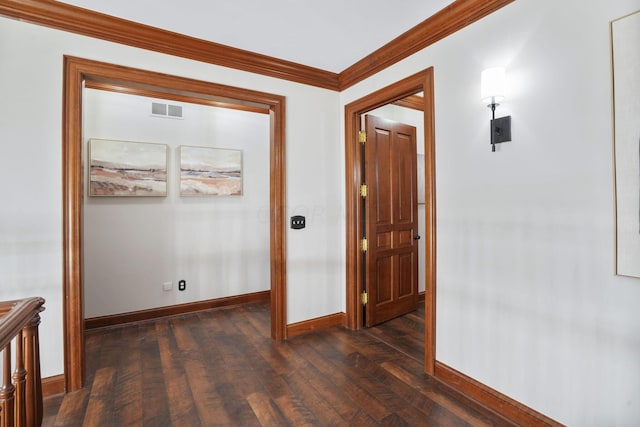 corridor with crown molding and dark wood-type flooring