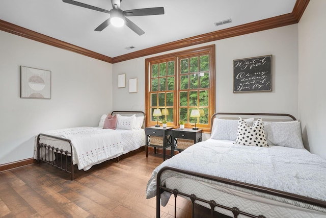 bedroom with ceiling fan, crown molding, and dark wood-type flooring