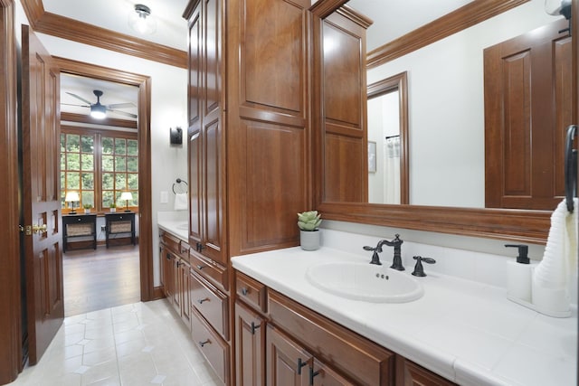 bathroom featuring wood-type flooring, vanity, ceiling fan, and crown molding