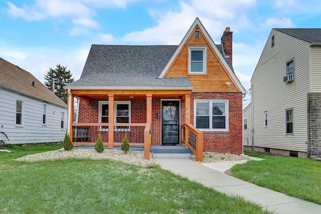 1468 E Whittier St, Columbus, OH 43206 - view of front of property featuring a chimney, a porch, a front lawn, and brick siding