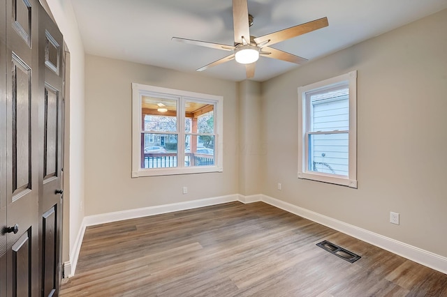 1468 E Whittier St, Columbus, OH 43206 - empty room with wood finished floors and ceiling fan