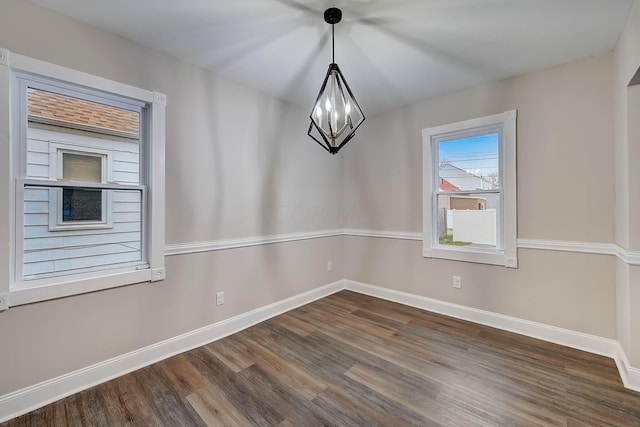 1468 E Whittier St, Columbus, OH 43206 - unfurnished dining area featuring dark wood finished floors and baseboards