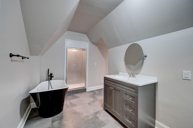 1468 E Whittier St, Columbus, OH 43206 - bathroom featuring vanity, lofted ceiling, and a soaking tub