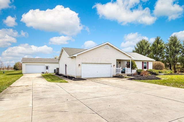 ranch-style house featuring a porch, a garage, and a front yard