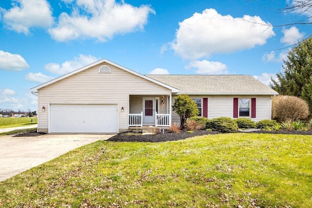 ranch-style house with covered porch, a garage, and a front yard