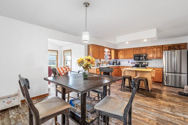 dining room with hardwood / wood-style floors