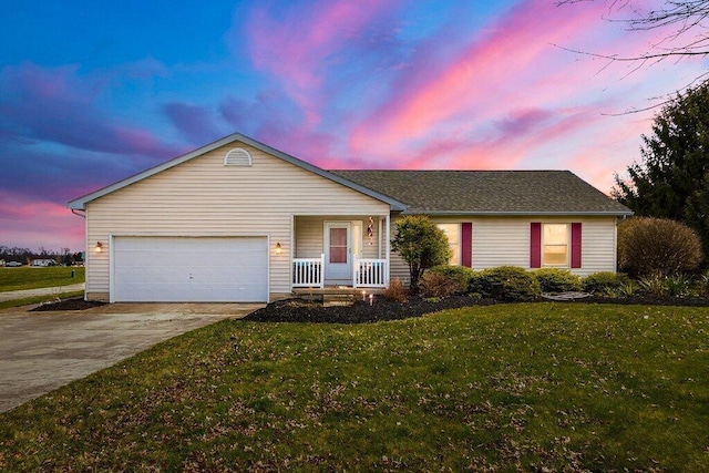 single story home featuring a lawn, covered porch, and a garage