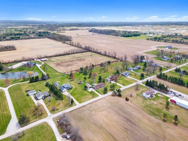 bird's eye view with a rural view and a water view