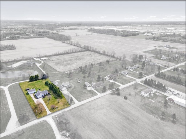 birds eye view of property featuring a rural view